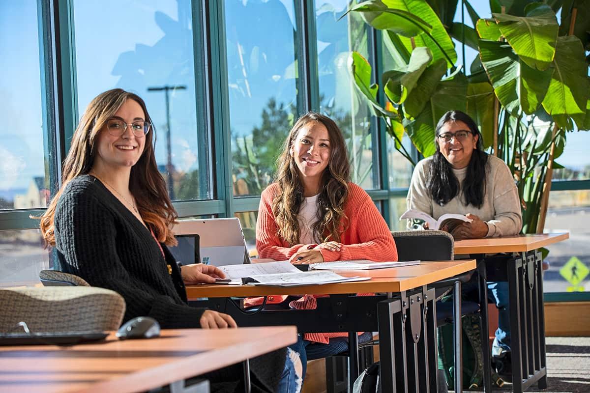 smiling students in the main library